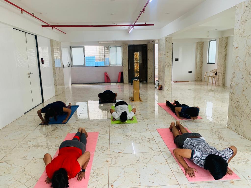 Yoga instructor guiding students in Pune